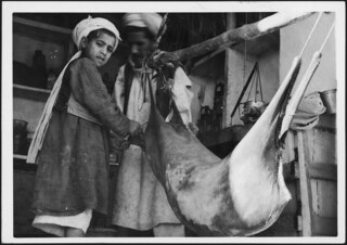 How about some "mast"? In the early morning in the bazar they fill a ferment powder in the milk bag in order to make the milk sour. "Mast" is the most common beverage besides tea, - no liquor or wine or beeris avaiable in Afghanistan. | Photo A. Schwarzenbach