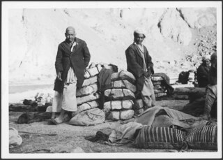 Mongol Hazarah, transporting salt stones on donkey back, putting up their camp in a Hindu Kush vallay. A donkey load is of two stones. | Coal + other minerals, also oil, exist in Afghanistan's mountains, but cannot be exploited because there are no roads. Would the Russians built them? | Photo Annemarie Schwarzenbach